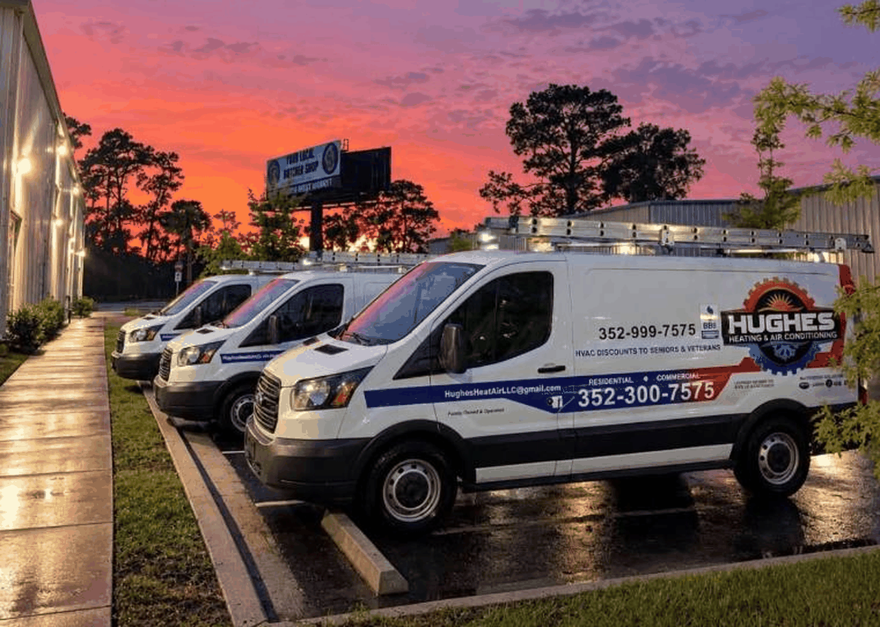 Hughes Heating & Air, LLC. service vans at their Ocala shop